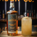 Bottle of Larrikin American Light Whiskey Aged 7 Years Single Barrel Overproof 750ml with a cocktail glass