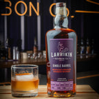 Bottle of Larrikin Single Barrel Kentucky Straight Bourbon Whiskey 750ml with a cocktail glass